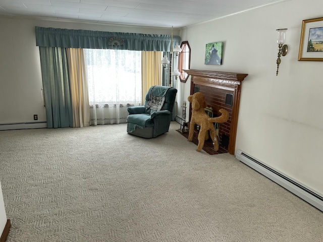 sitting room featuring ornamental molding, carpet, and a baseboard heating unit