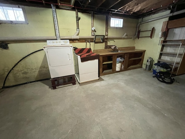 basement with washer / dryer, a wealth of natural light, and a workshop area