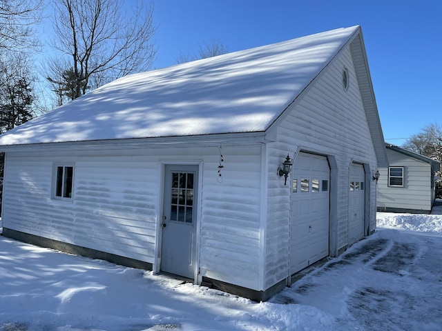 view of snow covered garage