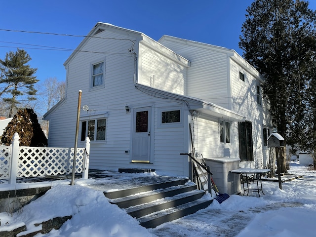 view of snow covered house