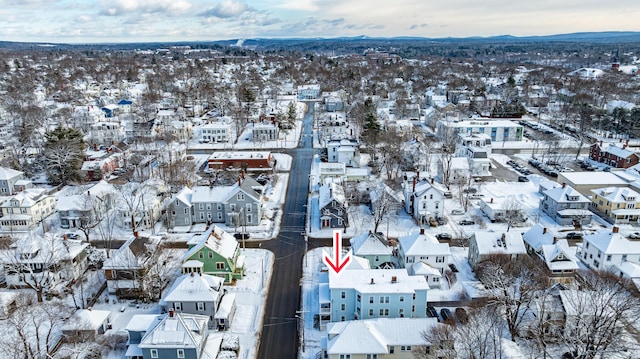 snowy aerial view with a mountain view