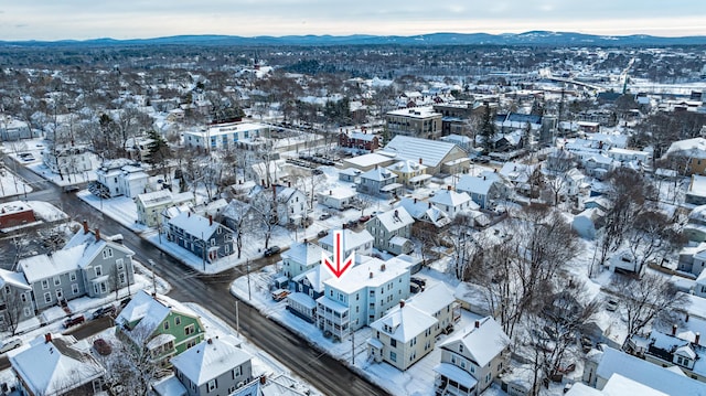 snowy aerial view with a mountain view