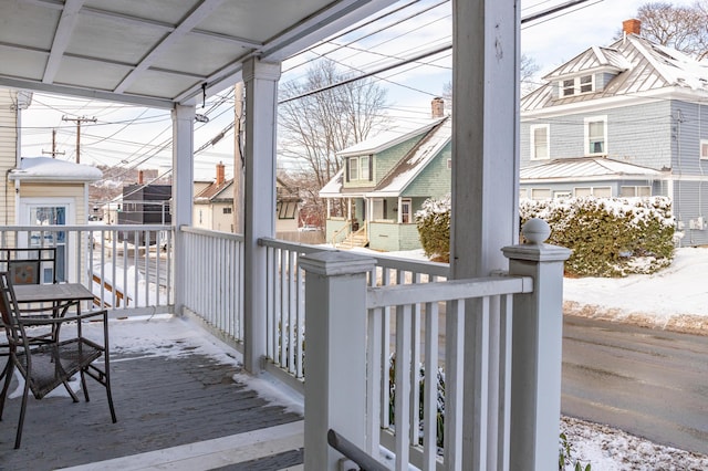 view of snow covered deck