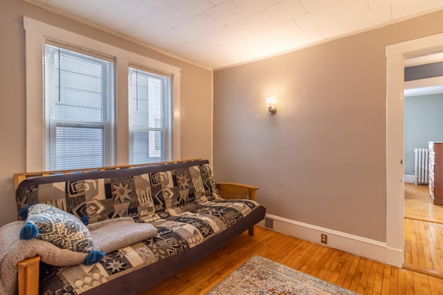 living room featuring ornamental molding and hardwood / wood-style floors