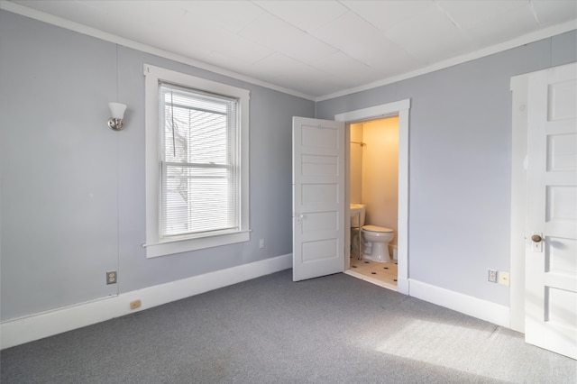 unfurnished bedroom featuring ornamental molding and carpet