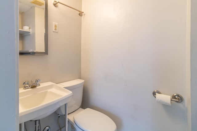 bathroom with sink and toilet