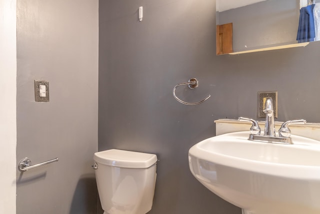 bathroom featuring sink and toilet