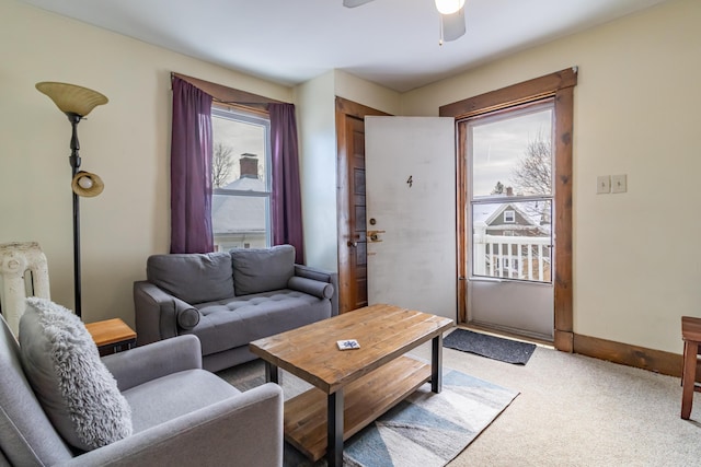 living room with carpet and ceiling fan