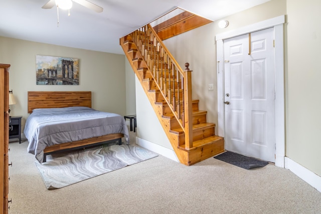 bedroom with ceiling fan and carpet flooring