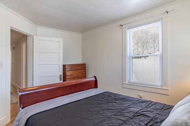 bedroom featuring crown molding