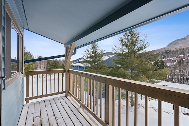 wooden terrace featuring a mountain view