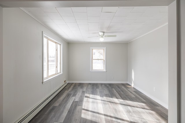 empty room featuring baseboards, ceiling fan, ornamental molding, wood finished floors, and baseboard heating