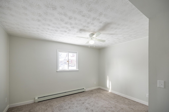 carpeted empty room with baseboards, a baseboard heating unit, and a textured ceiling