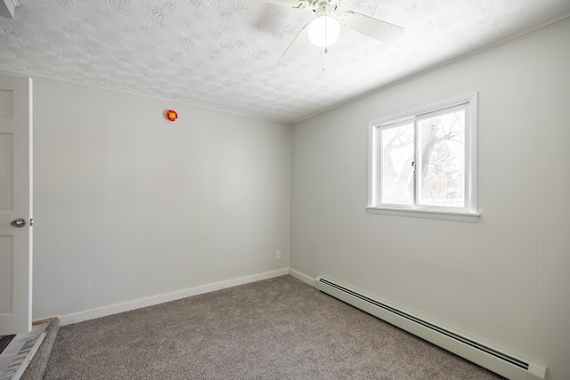 unfurnished room featuring light colored carpet, a textured ceiling, and baseboard heating