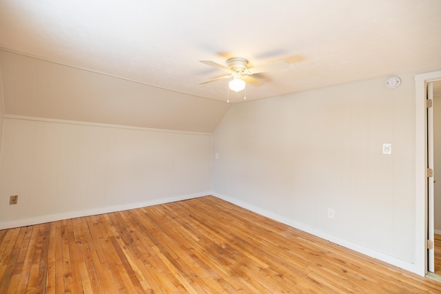 additional living space with lofted ceiling, ceiling fan, and wood finished floors