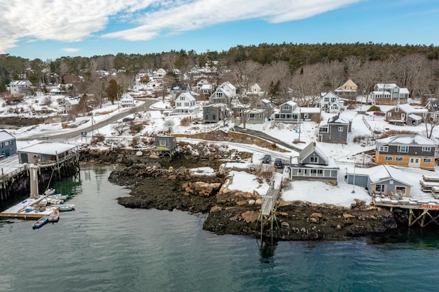 birds eye view of property with a residential view and a water view