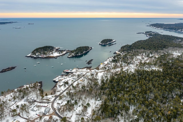 aerial view at dusk with a water view