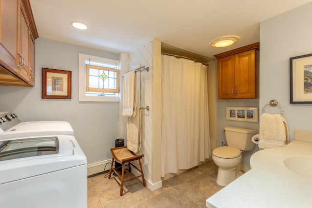 interior space with toilet, a shower with shower curtain, a baseboard radiator, baseboards, and washing machine and clothes dryer