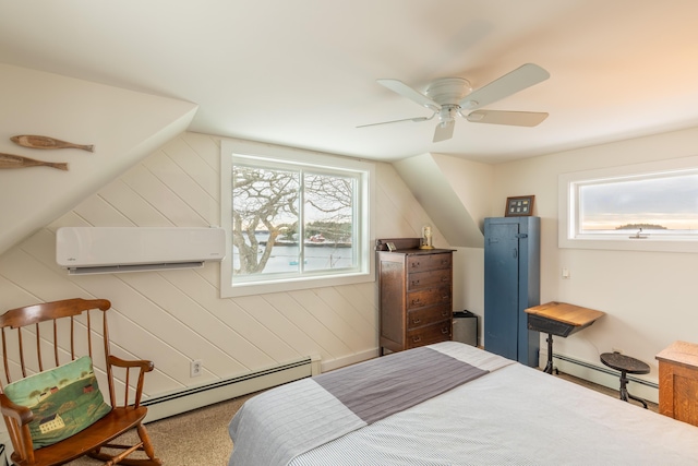 bedroom featuring an AC wall unit, a ceiling fan, and baseboard heating