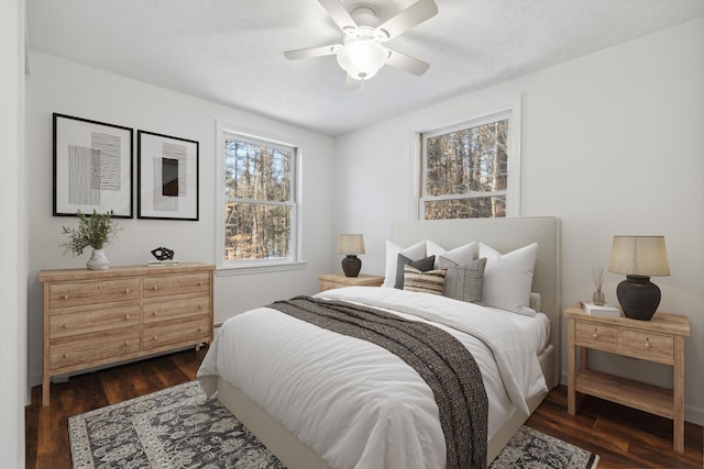 bedroom featuring dark wood-type flooring and ceiling fan