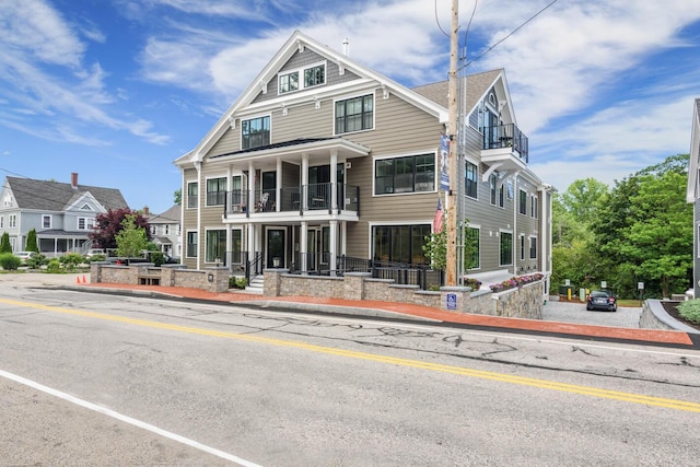 view of front of house with a balcony
