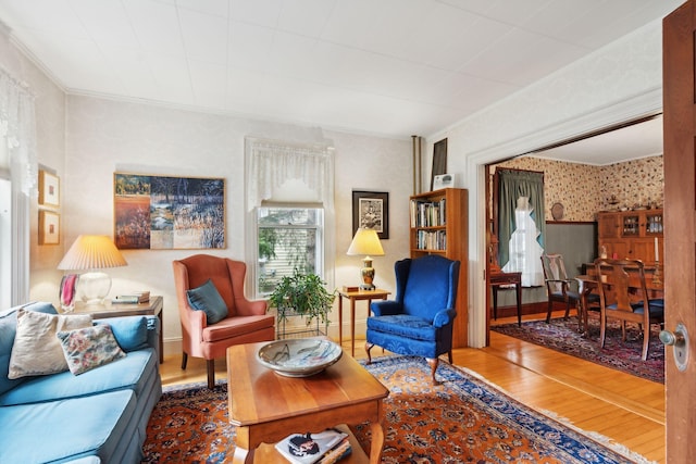 living room featuring ornamental molding and hardwood / wood-style floors