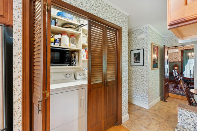 laundry area with crown molding