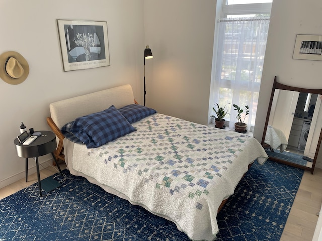 bedroom with hardwood / wood-style flooring