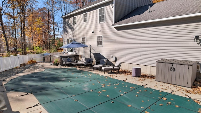 exterior space featuring an outdoor hangout area and a patio area