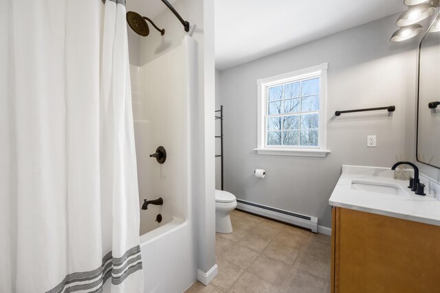 full bathroom with tile patterned flooring, vanity, a baseboard heating unit, toilet, and shower / bath combo with shower curtain