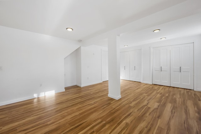 additional living space featuring wood-type flooring