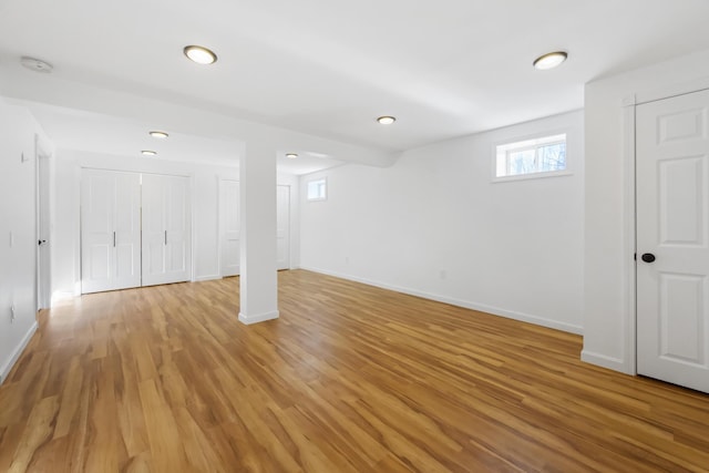 basement featuring light hardwood / wood-style floors