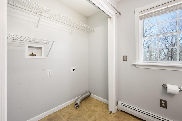 laundry room featuring tile patterned flooring, a baseboard radiator, and hookup for an electric dryer