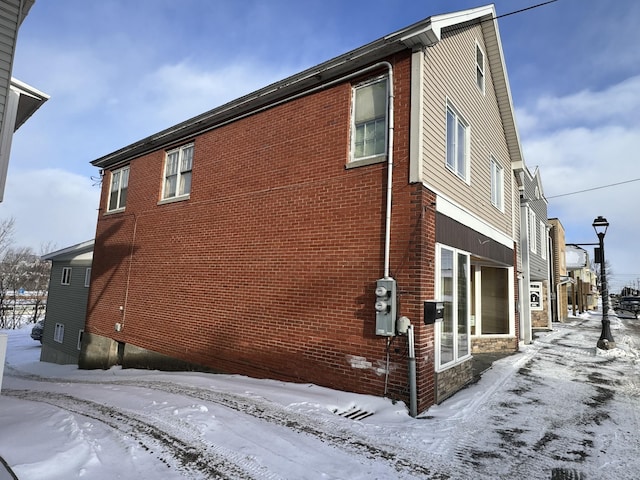 view of snow covered property