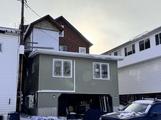 view of back house at dusk