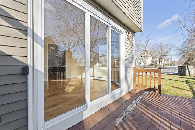 wooden deck featuring a baseboard radiator