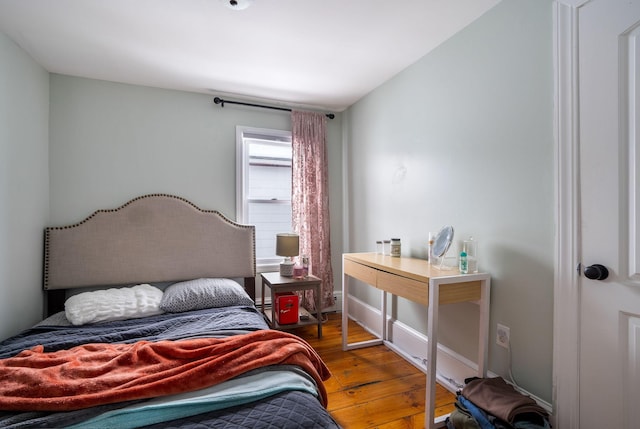 bedroom featuring hardwood / wood-style flooring