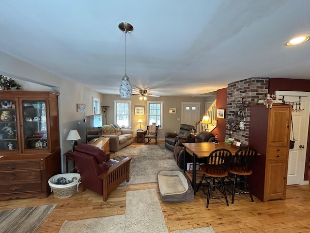 interior space with ceiling fan and light hardwood / wood-style floors