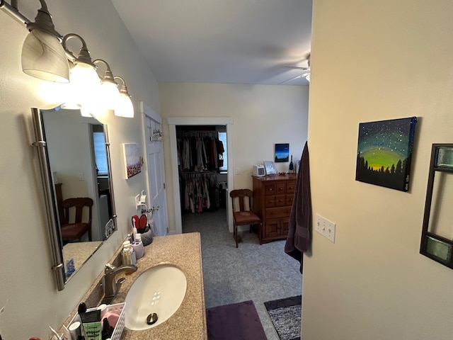 bathroom featuring vanity and ceiling fan