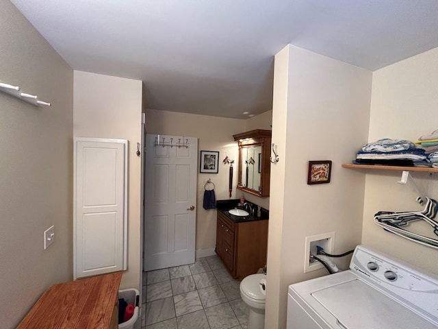 washroom featuring sink and washer / dryer