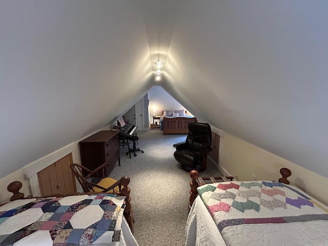 carpeted bedroom with lofted ceiling