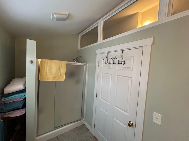 bathroom featuring walk in shower