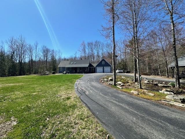 21 Dream Ln, Belfast, ME 04915 - ranch-style home with driveway and a front yard