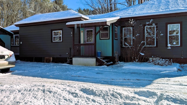 view of snow covered house