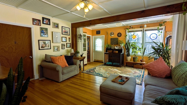 living room featuring hardwood / wood-style flooring, plenty of natural light, and ceiling fan