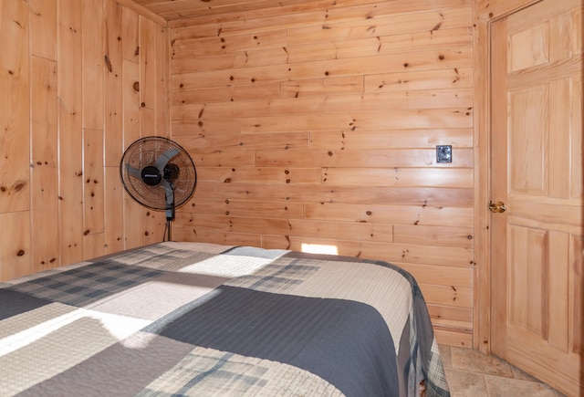 unfurnished bedroom with wood walls