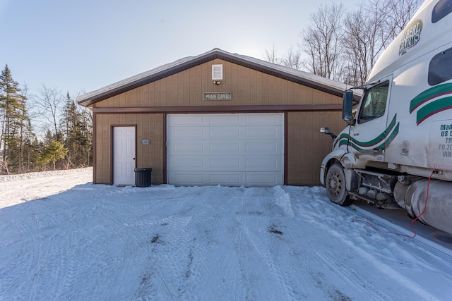 view of snow covered garage