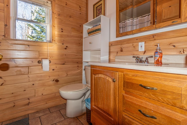 bathroom featuring vanity, a shower with curtain, toilet, and wood walls