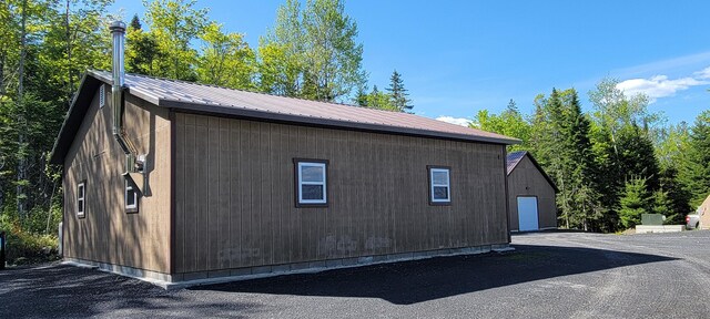 685 Main St, Grand Isle, ME 04746 - view of side of home featuring metal roof