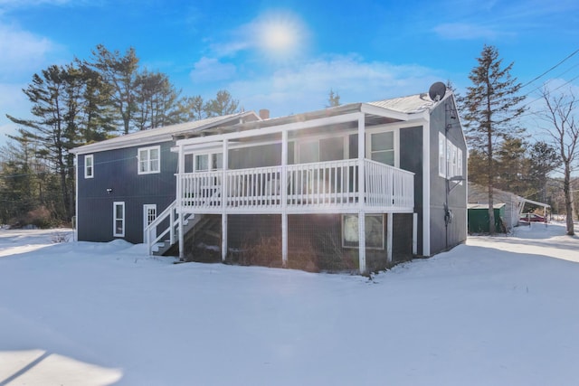 view of snow covered house